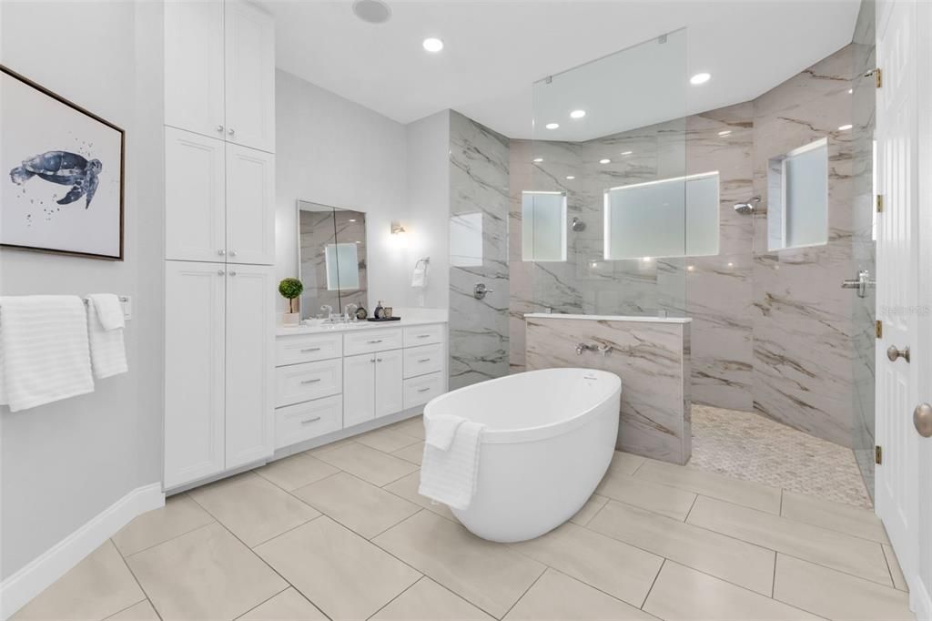 Bathroom, Dual Sink Vanities, Free Standing Baths, Glass Shower, Interior, Marble Walls, Recessed Lighting