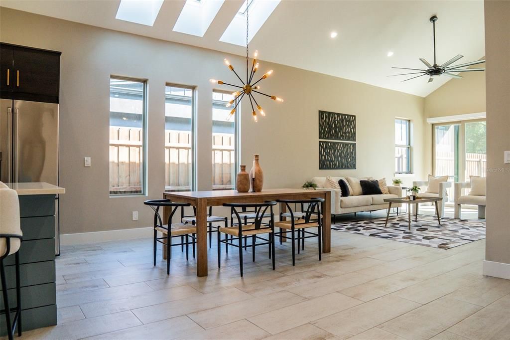 Dining room, Interior, Living room, Pendant Lights, Recessed Lighting, Stainless Steel Appliances, Wood Texture Flooring