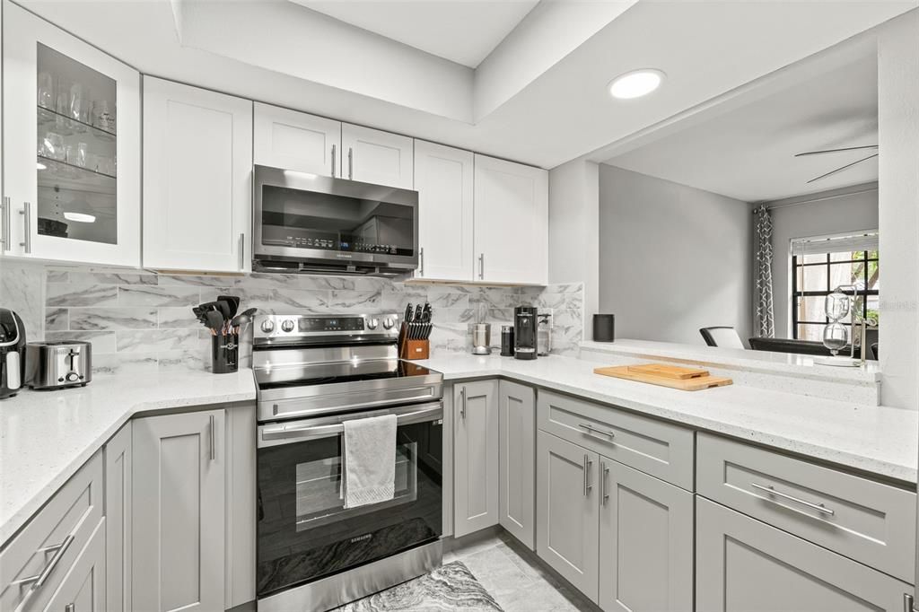 Interior, Kitchen, Marble Walls, Recessed Lighting, Stainless Steel Appliances