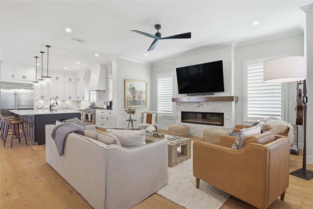 Fireplace, Interior, Kitchen, Living room, Pendant Lights, Recessed Lighting, Stainless Steel Appliances, Wood Texture Flooring