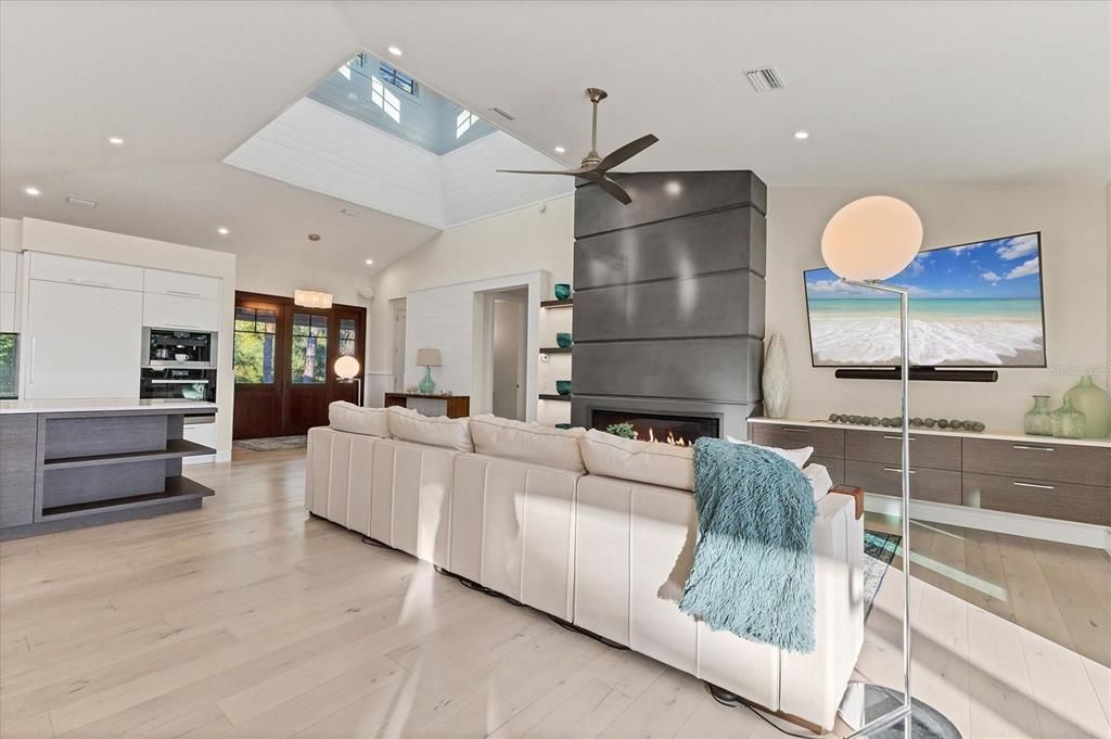 Fireplace, Interior, Kitchen, Living room, Pendant Lights, Recessed Lighting, Stainless Steel Appliances, Wood Texture Flooring