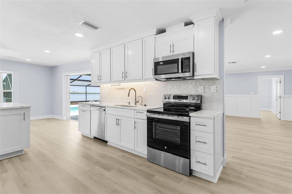 Interior, Kitchen, Recessed Lighting, Stainless Steel Appliances, Wood Texture Flooring