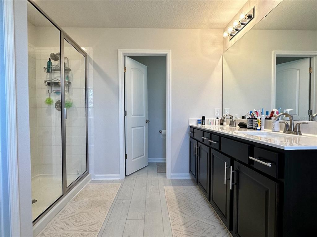 Bathroom, Dual Sink Vanities, Glass Shower, Interior, Wood Texture Flooring