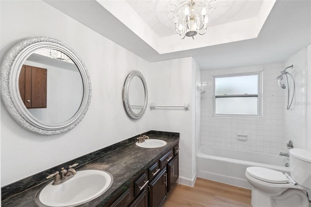 Bathroom, Chandelier, Dual Sink Vanities, Interior, Wood Texture Flooring