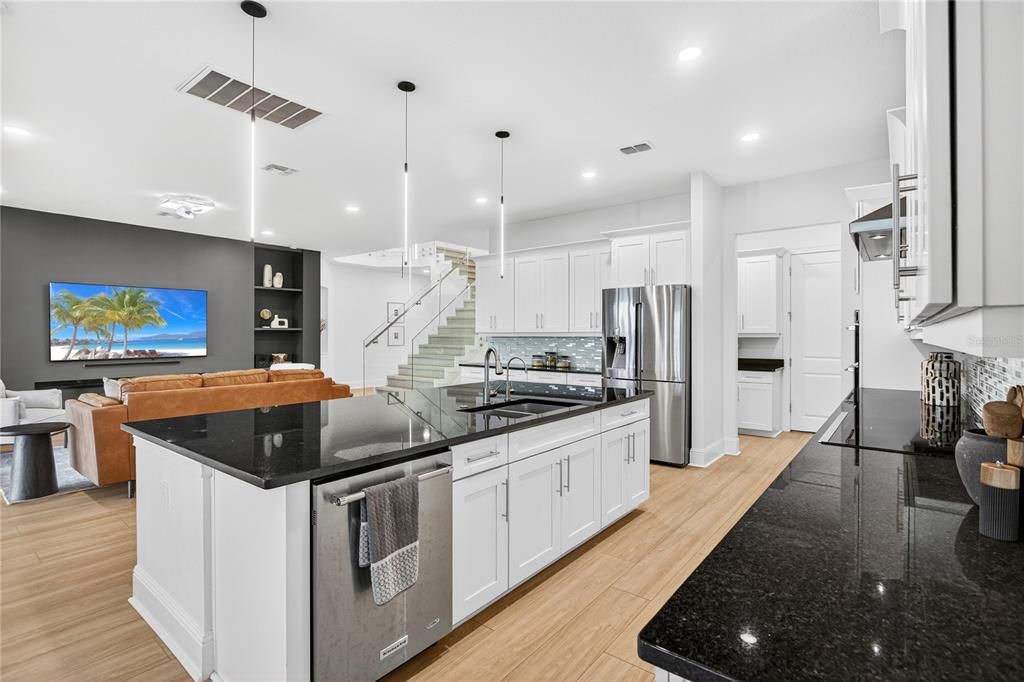 Dining room, Interior, Kitchen, Pendant Lights, Recessed Lighting, Stainless Steel Appliances, Wood Texture Flooring