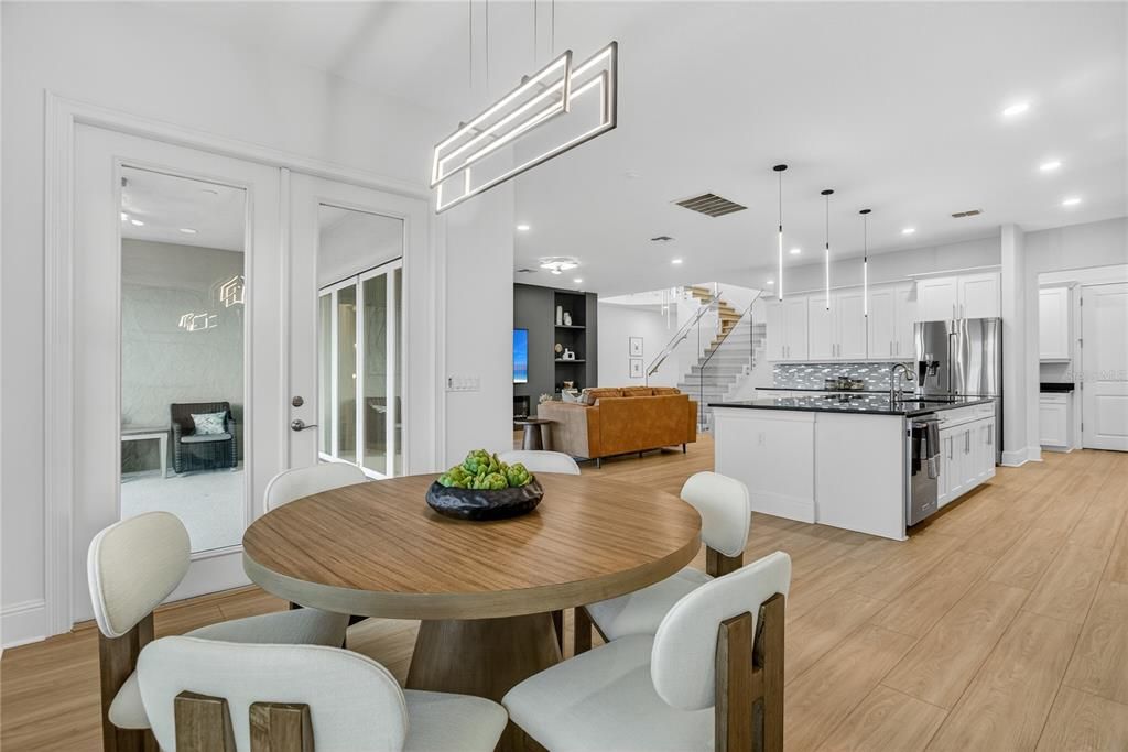 Dining room, Interior, Kitchen, Living room, Pendant Lights, Recessed Lighting, Stainless Steel Appliances, Wood Texture Flooring