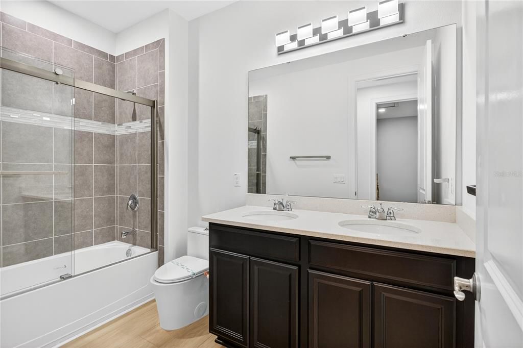 Bathroom, Dual Sink Vanities, Glass Shower, Interior, Wood Texture Flooring