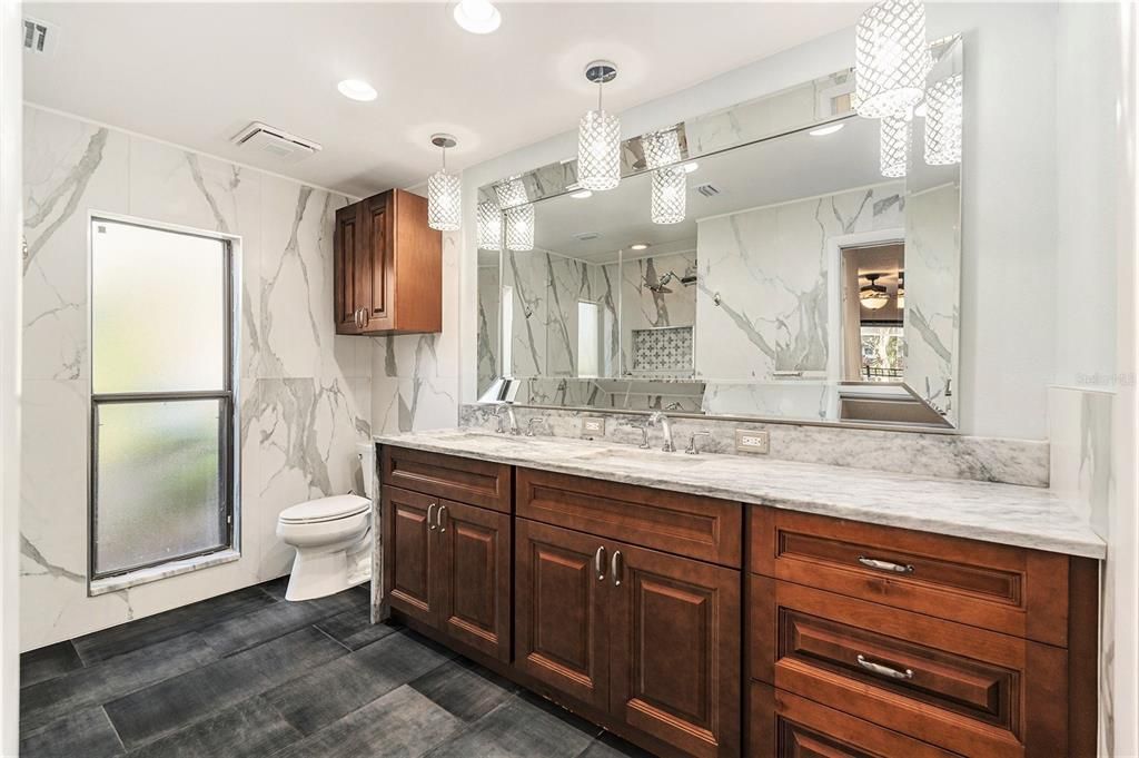 Bathroom, Dual Sink Vanities, Interior, Marble Walls, Pendant Lights, Recessed Lighting