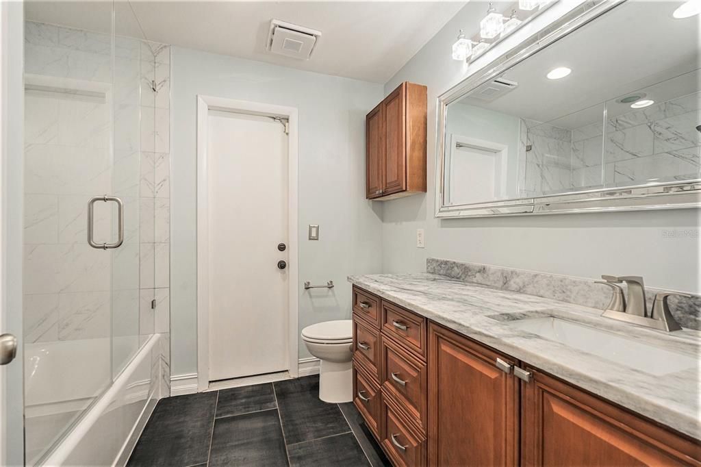 Bathroom, Dual Sink Vanities, Glass Shower, Interior, Marble Walls, Recessed Lighting