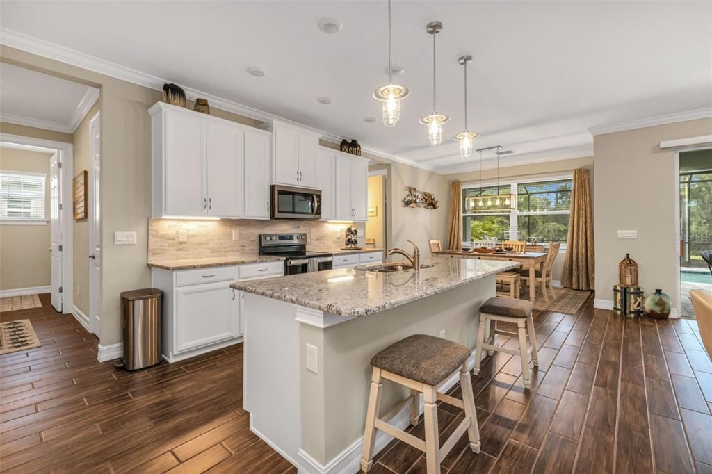 Dining room, Interior, Kitchen, Pendant Lights, Stainless Steel Appliances, Wood Texture Flooring