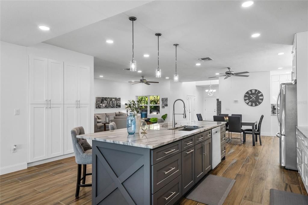 Dining room, Interior, Kitchen, Pendant Lights, Recessed Lighting, Stainless Steel Appliances, Wood Texture Flooring