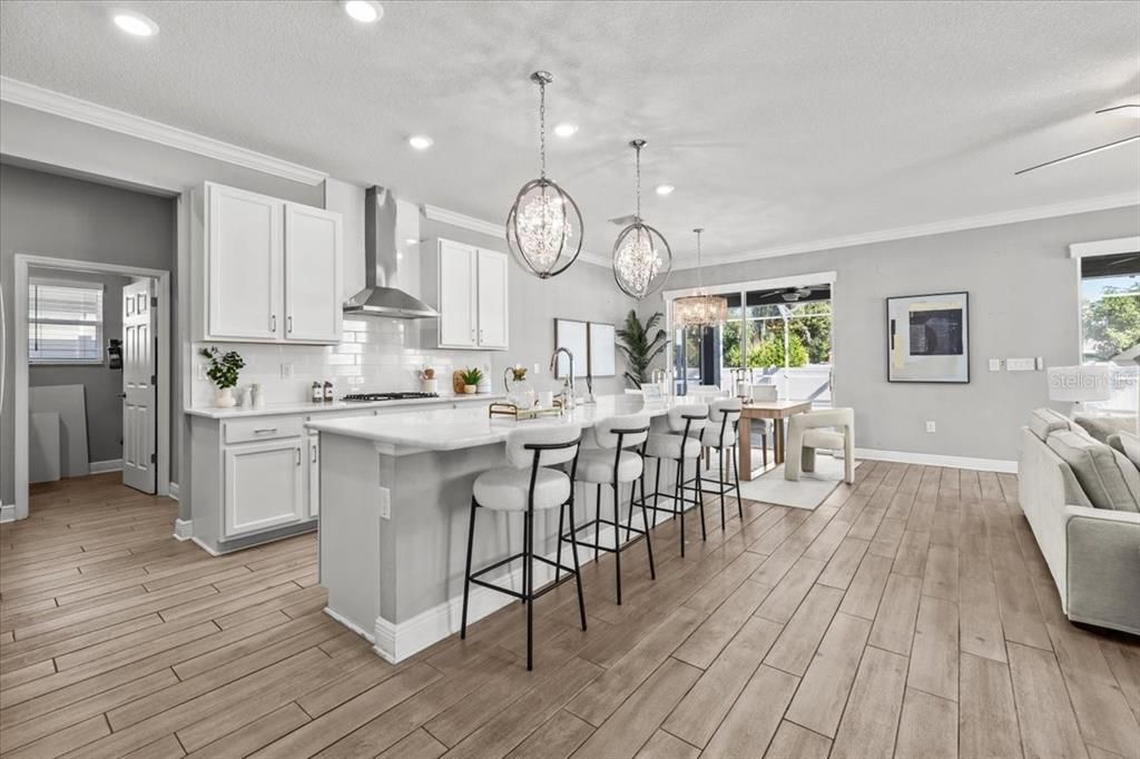 Dining room, Interior, Kitchen, Pendant Lights, Recessed Lighting, Stainless Steel Appliances, Wood Texture Flooring