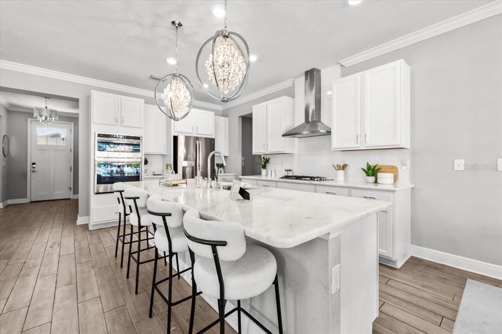 Chandelier, Interior, Kitchen, Pendant Lights, Recessed Lighting, Stainless Steel Appliances, Wood Texture Flooring