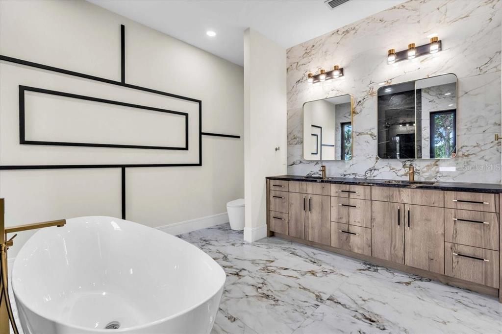 Bathroom, Dual Sink Vanities, Free Standing Baths, Interior, Marble, Marble Walls, Recessed Lighting
