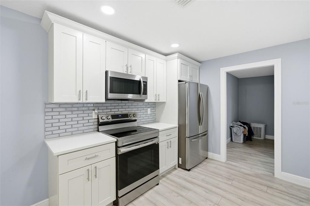 Interior, Kitchen, Recessed Lighting, Stainless Steel Appliances, Wood Texture Flooring