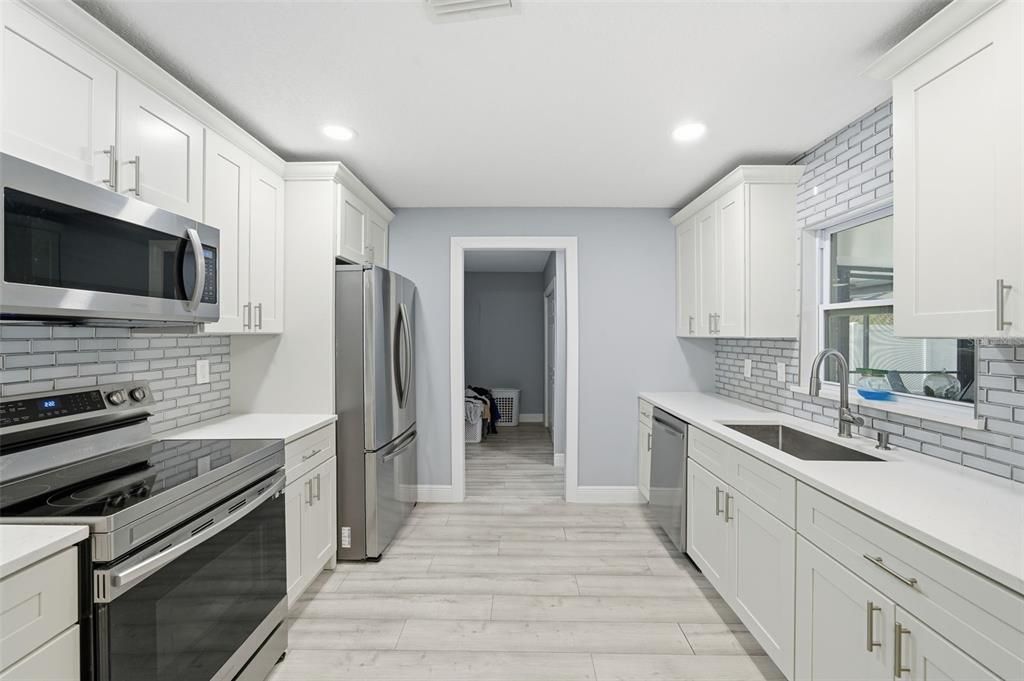 Interior, Kitchen, Recessed Lighting, Stainless Steel Appliances, Wood Texture Flooring