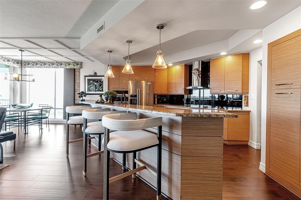 Dining room, Interior, Kitchen, Pendant Lights, Recessed Lighting, Stainless Steel Appliances, Wood Texture Flooring