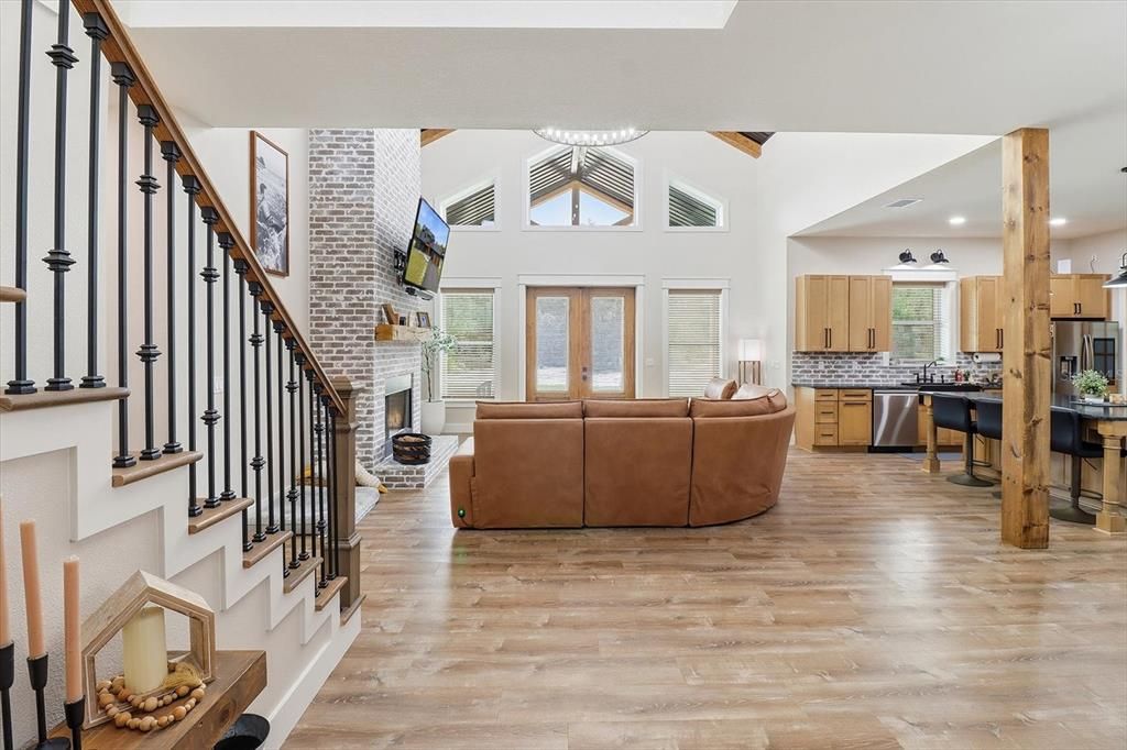 Fireplace, Interior, Kitchen, Living room, Recessed Lighting, Stainless Steel Appliances, Stone Walls, Wooden Beams, Wood Texture Flooring