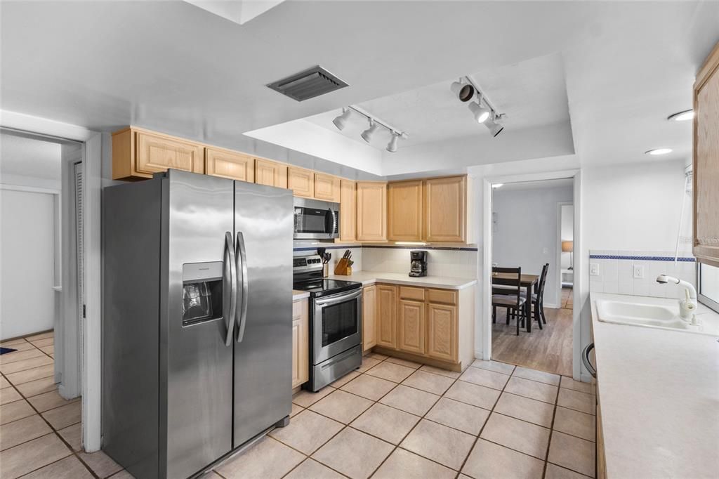 Dining room, Interior, Kitchen, Recessed Lighting, Stainless Steel Appliances, Wood Texture Flooring