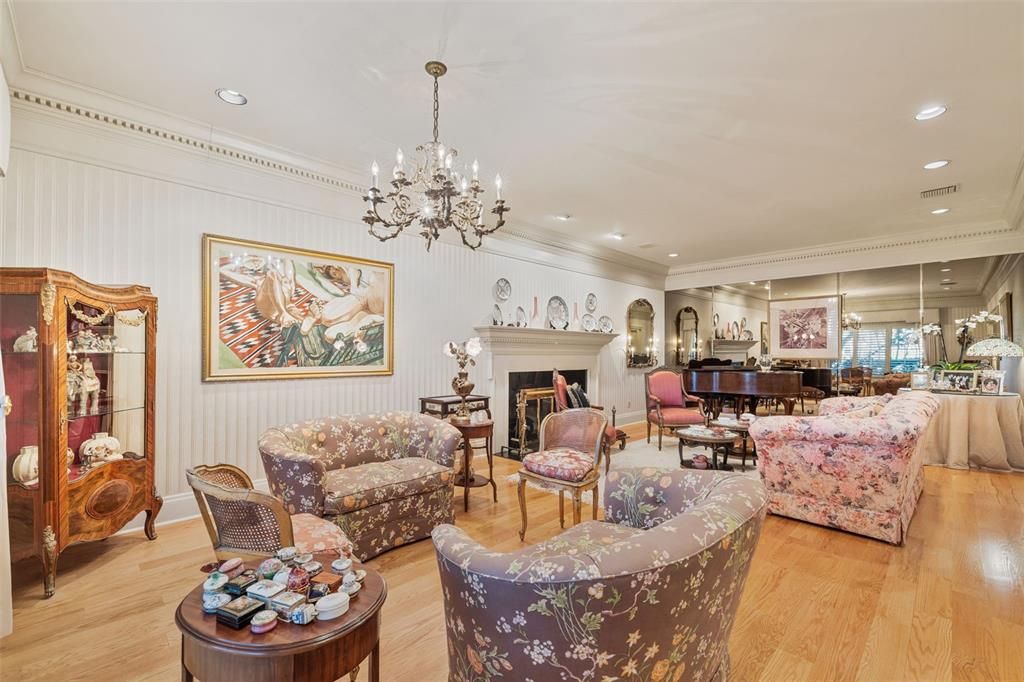 Chandelier, Fireplace, Interior, Living room, Piano, Recessed Lighting, Wood Texture Flooring