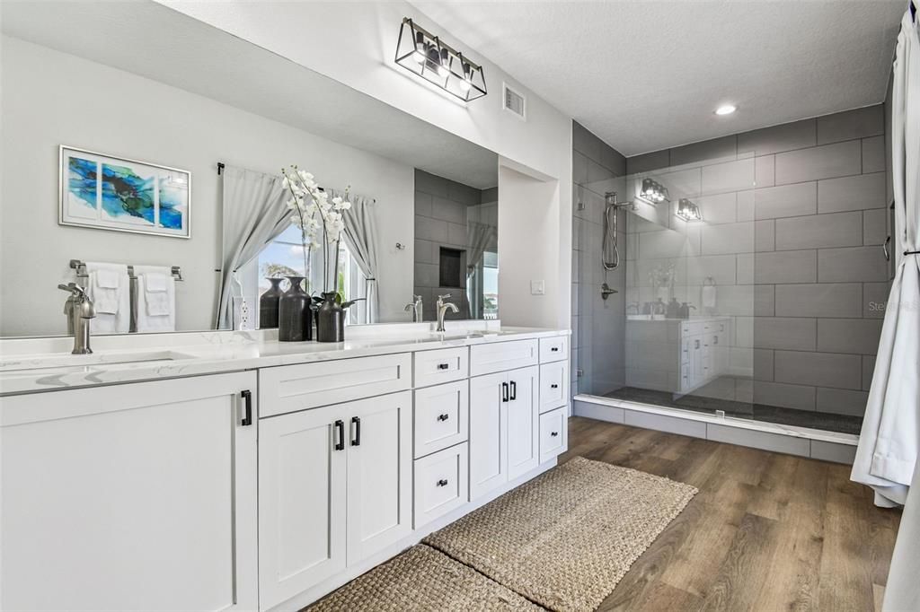 Bathroom, Dual Sink Vanities, Glass Shower, Interior, Recessed Lighting, Wood Texture Flooring