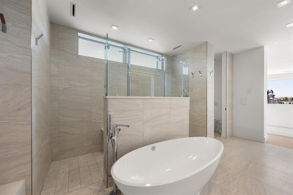 Bathroom, Free Standing Baths, Glass Shower, Interior, Marble Walls, Recessed Lighting