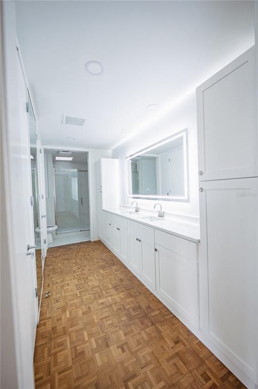 Bathroom, Dual Sink Vanities, Glass Shower, Interior, Recessed Lighting, Wood Texture Flooring