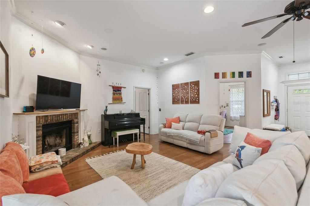 Fireplace, Interior, Living room, Piano, Recessed Lighting, Wood Texture Flooring