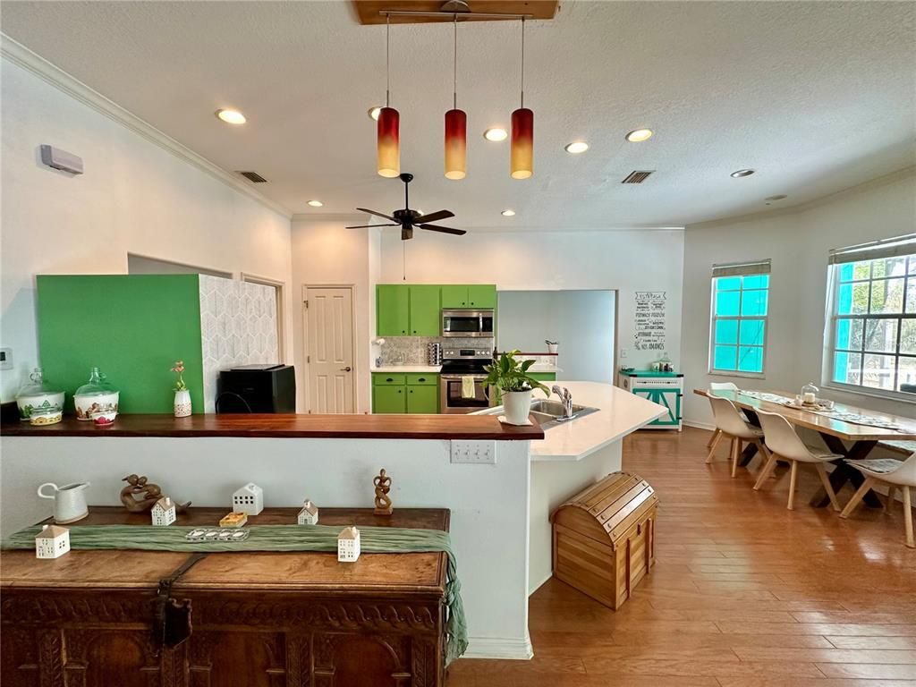 Dining room, Interior, Kitchen, Pendant Lights, Recessed Lighting, Stainless Steel Appliances, Wood Texture Flooring