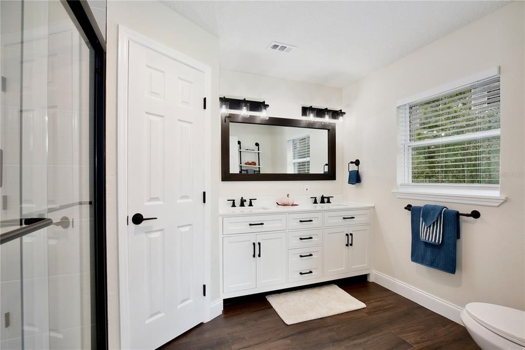 Bathroom, Dual Sink Vanities, Glass Shower, Interior, Wood Texture Flooring