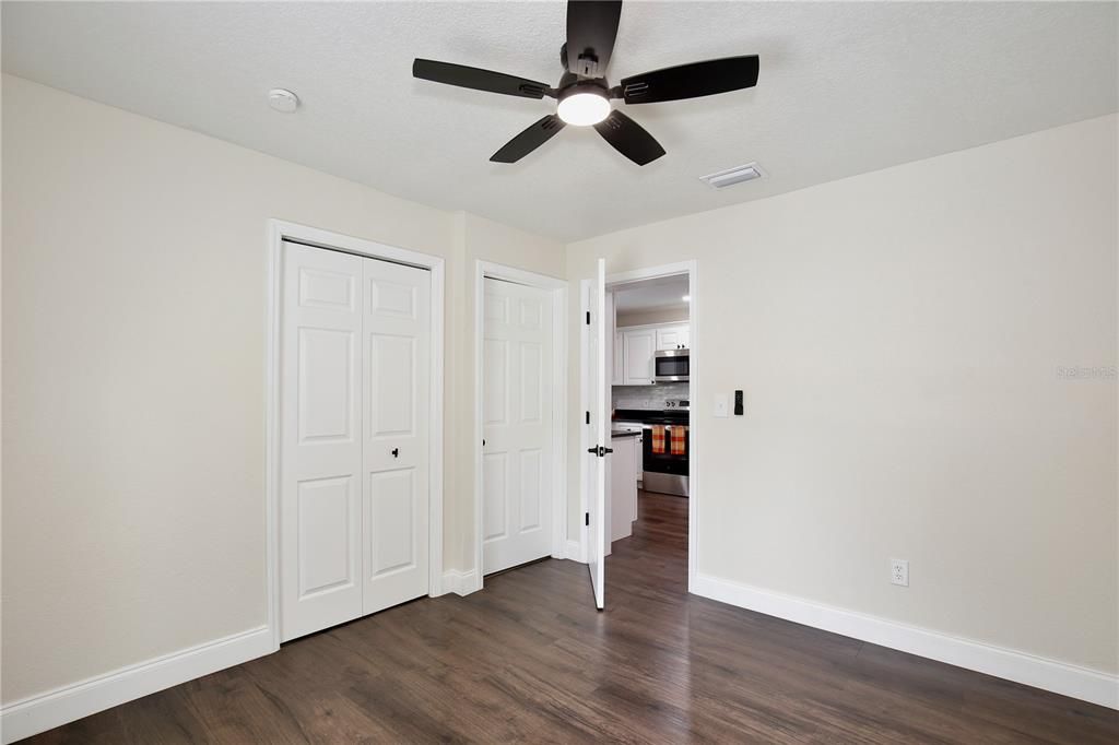 Empty room, Interior, Kitchen, Stainless Steel Appliances, Wood Texture Flooring