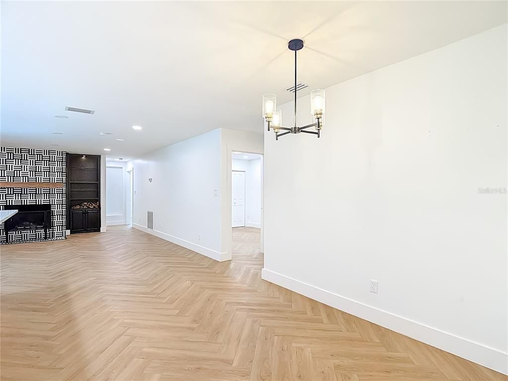 Empty room, Fireplace, Interior, Pendant Lights, Recessed Lighting, Wood Texture Flooring