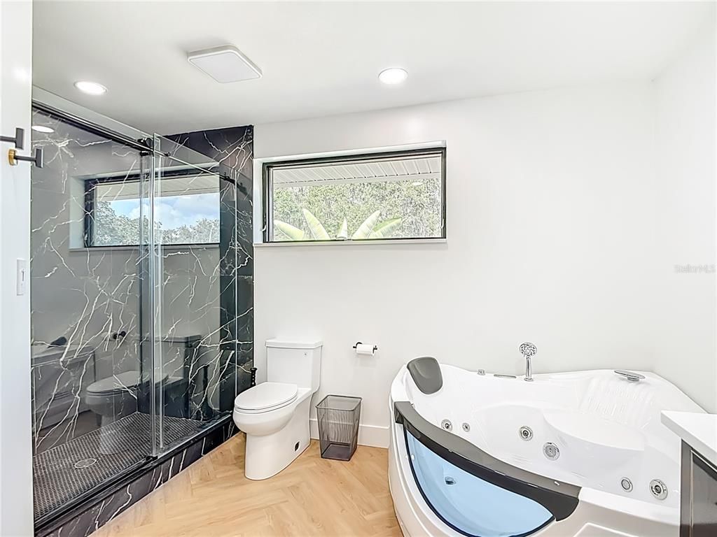 Bathroom, Glass Shower, Interior, Marble Walls, Recessed Lighting, Wood Texture Flooring