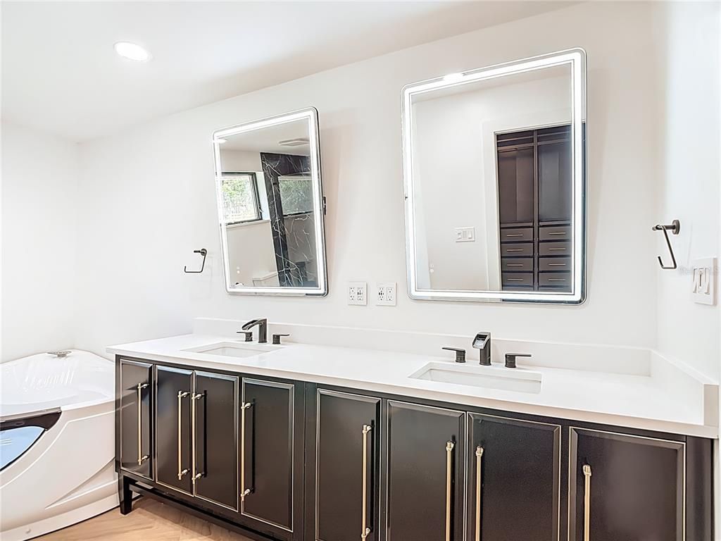 Bathroom, Dual Sink Vanities, Interior, Recessed Lighting, Wood Texture Flooring
