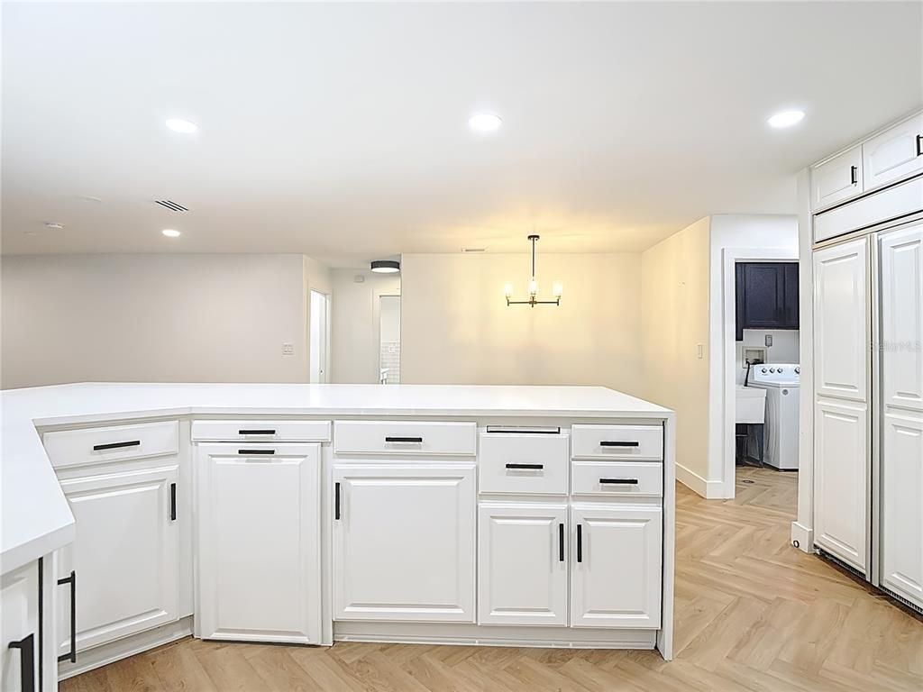 Interior, Kitchen, Recessed Lighting, Washer, Wood Texture Flooring