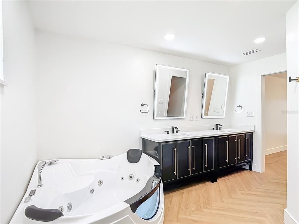 Bathroom, Dual Sink Vanities, Interior, Recessed Lighting, Wood Texture Flooring