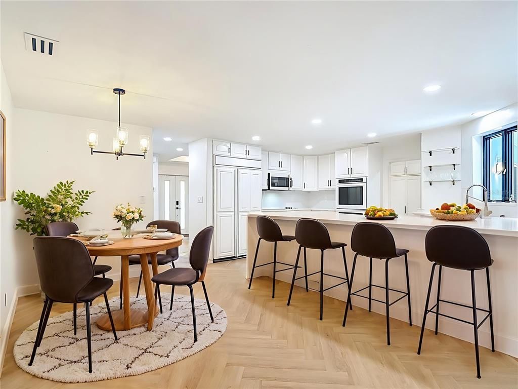 Chandelier, Dining room, Interior, Kitchen, Pendant Lights, Recessed Lighting, Stainless Steel Appliances, Wood Texture Flooring