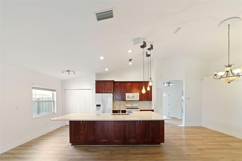 Chandelier, Interior, Kitchen, Pendant Lights, Recessed Lighting, Stainless Steel Appliances, Wood Texture Flooring
