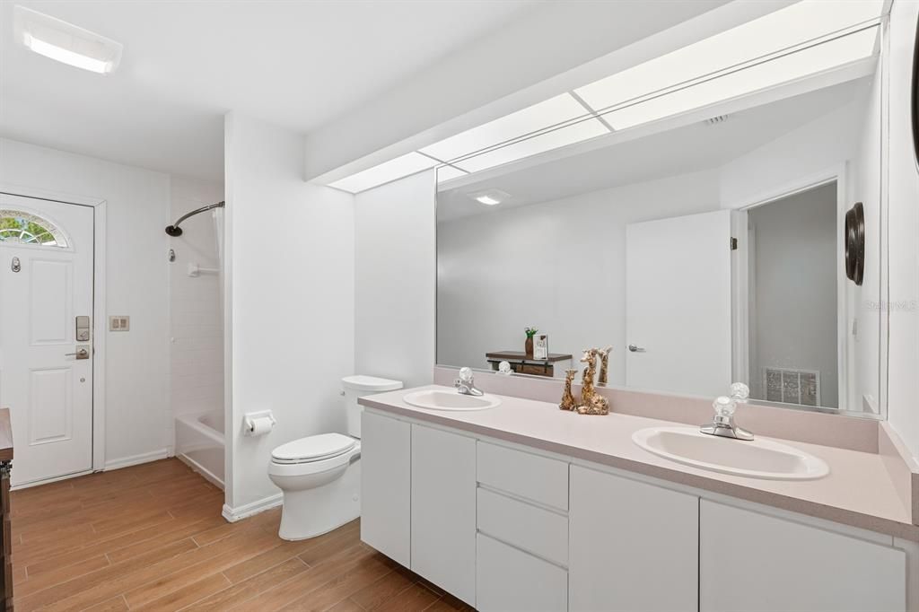 Bathroom, Dual Sink Vanities, Interior, Recessed Lighting, Wood Texture Flooring
