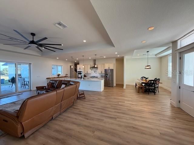 Dining room, Interior, Kitchen, Living room, Pendant Lights, Recessed Lighting, Stainless Steel Appliances, Water, Wood Texture Flooring