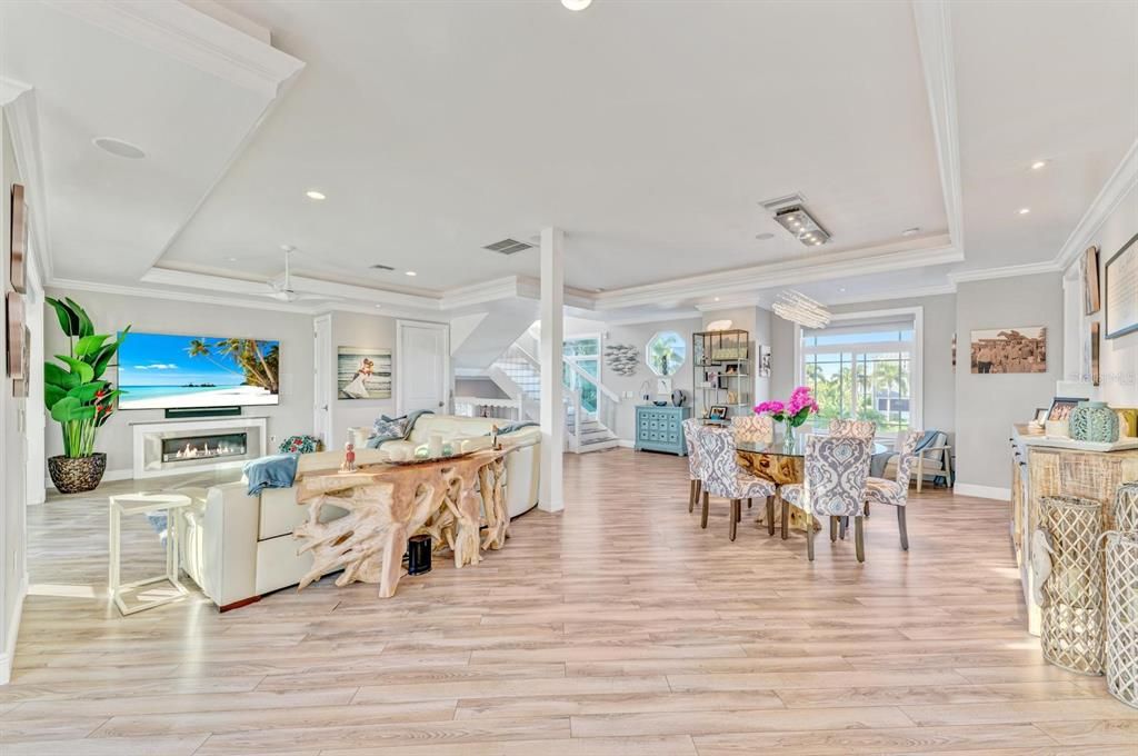 Dining room, Fireplace, Interior, Living room, Recessed Lighting, Wood Texture Flooring