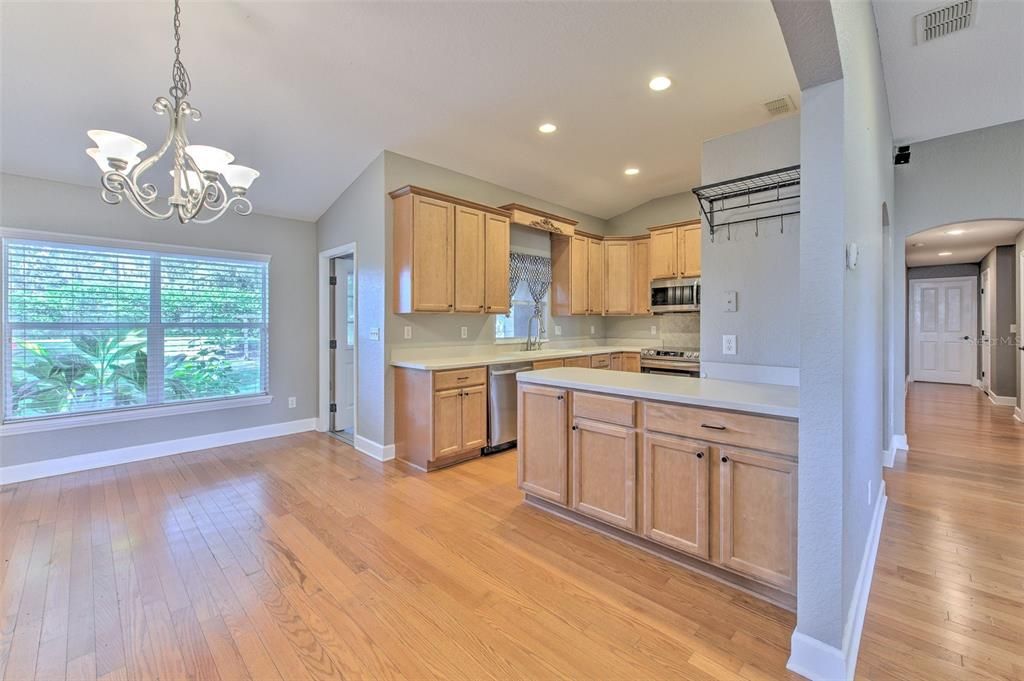 Chandelier, Interior, Kitchen, Pendant Lights, Recessed Lighting, Stainless Steel Appliances, Wood Texture Flooring