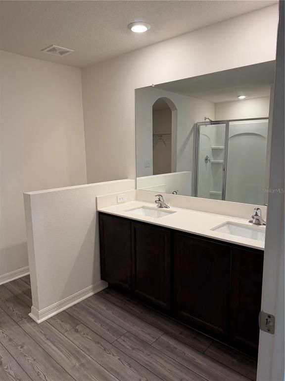 Bathroom, Dual Sink Vanities, Interior, Recessed Lighting, Wood Texture Flooring