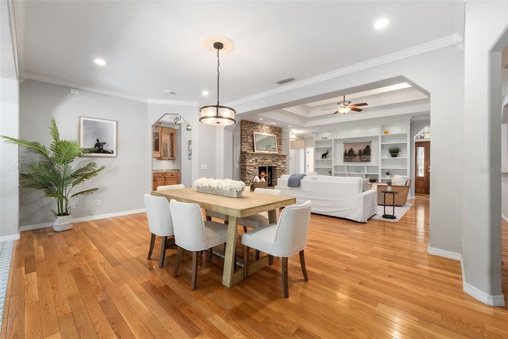 Dining room, Fireplace, Interior, Living room, Pendant Lights, Recessed Lighting, Wood Texture Flooring