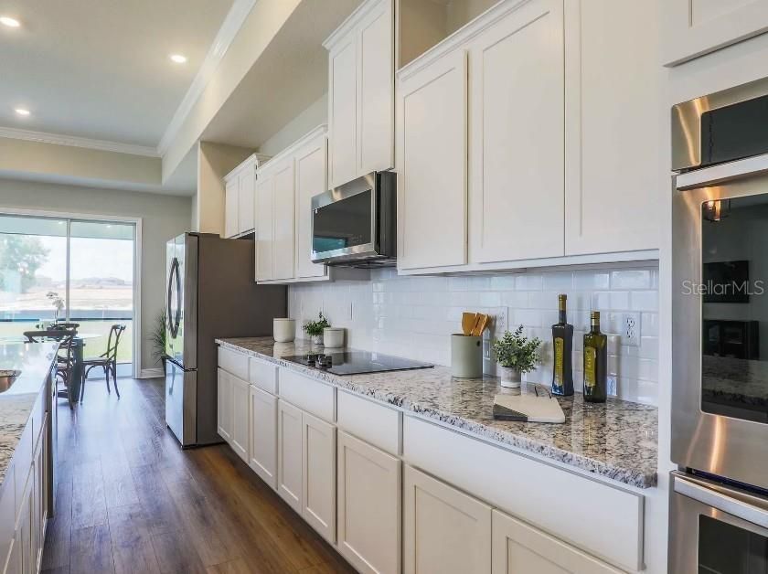 Dining room, Interior, Kitchen, Recessed Lighting, Stainless Steel Appliances, Water, Wood Texture Flooring