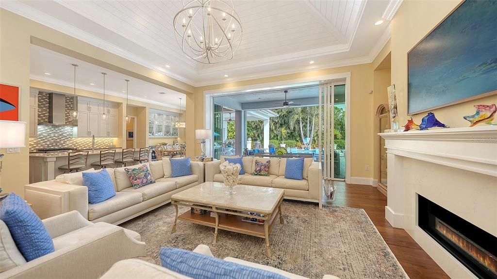 Chandelier, Fireplace, Interior, Living room, Pendant Lights, Recessed Lighting, Wood Texture Flooring