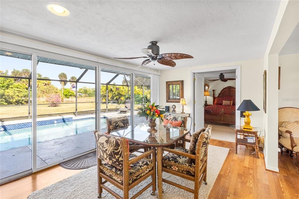 Dining room, Interior, Pool, Recessed Lighting, Sun Room, Wood Texture Flooring