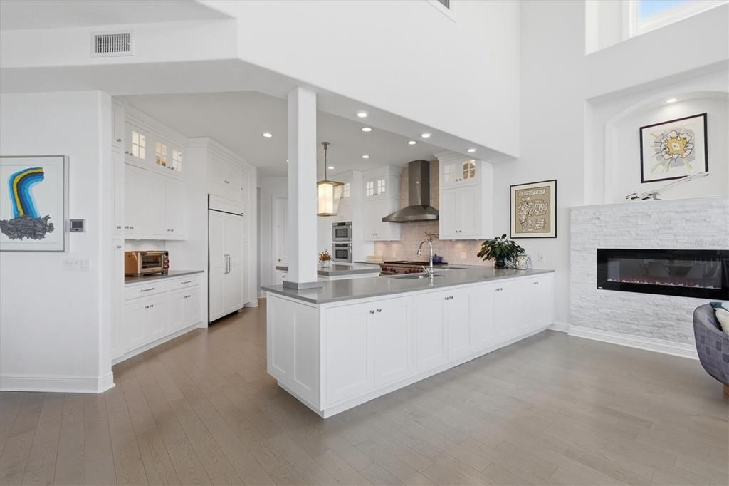 Fireplace, Interior, Kitchen, Pendant Lights, Recessed Lighting, Stainless Steel Appliances, Wood Texture Flooring