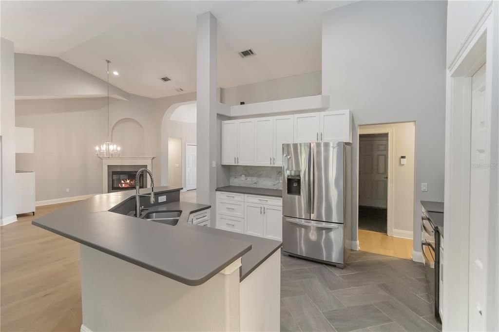 Fireplace, Interior, Kitchen, Pendant Lights, Recessed Lighting, Stainless Steel Appliances, Wood Texture Flooring