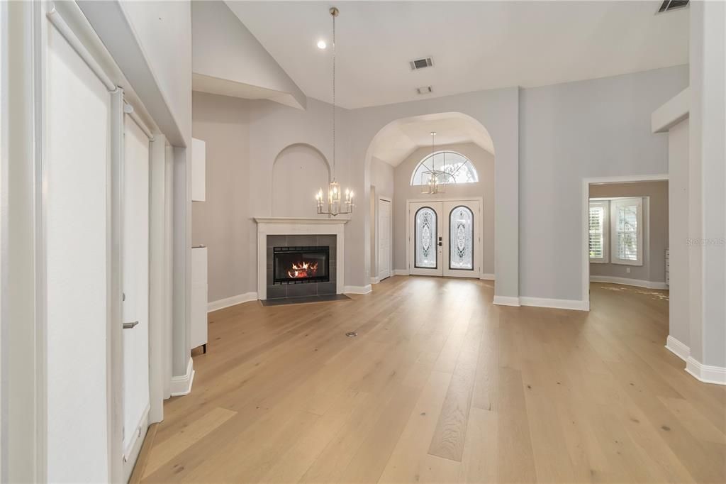 Empty room, Fireplace, Interior, Pendant Lights, Recessed Lighting, Wood Texture Flooring